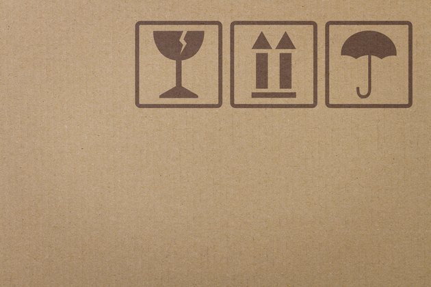 Safety icons on a cardboard box