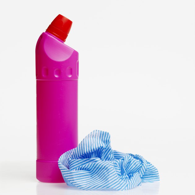 Close-up view of three cleaning product bottles