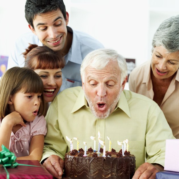man celebrating his birthday his wife and son