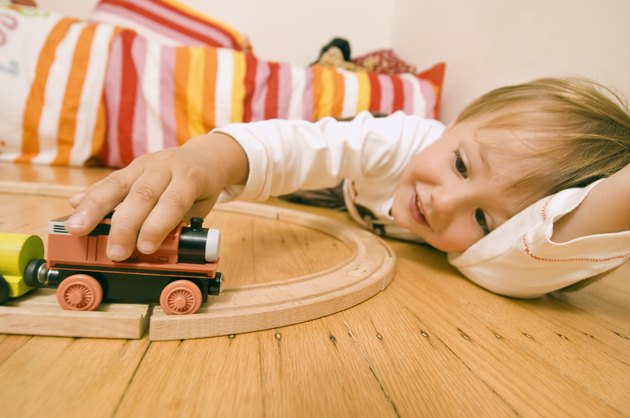 Boy playing with toy train