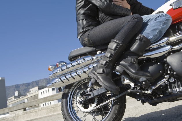 Couple riding motorcycle