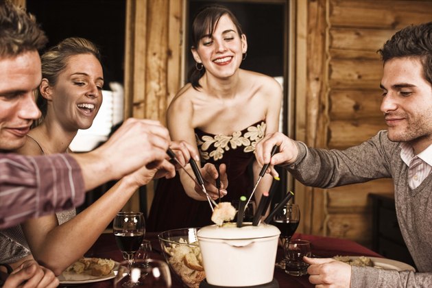 Friends having fondue