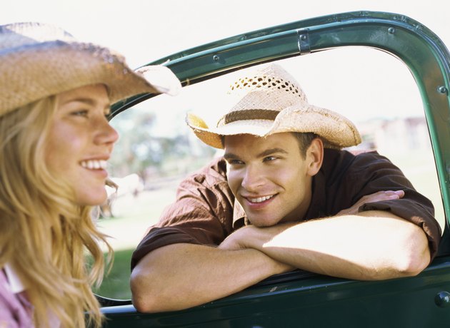 Young man looking at a Young woman in a car