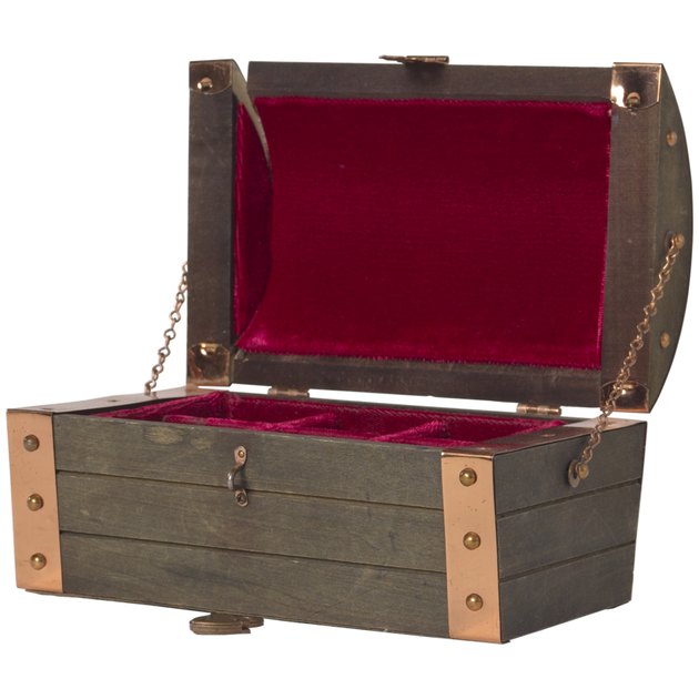 Open wood chest lined in velvet
