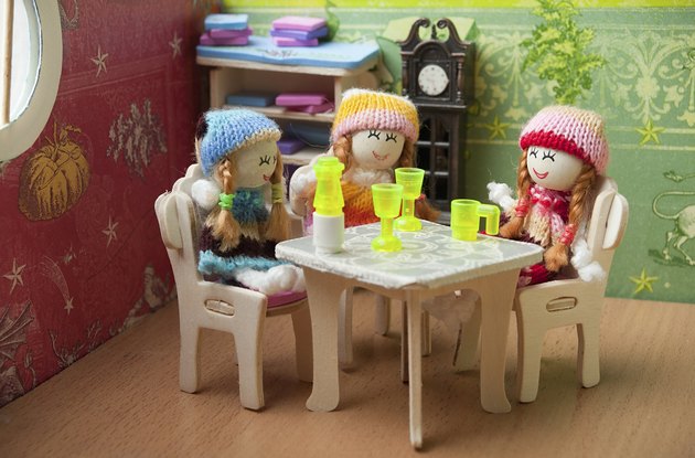 dolls at the table