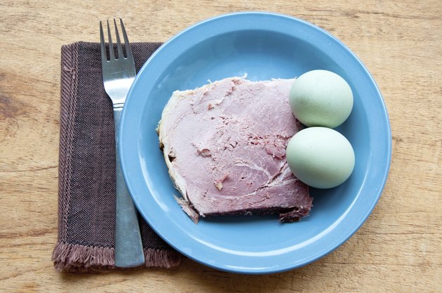 Green eggs and ham with fork, napkin