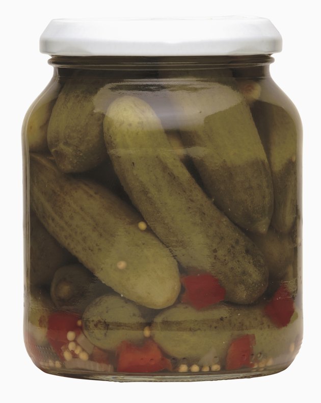 pickled cucumber and chilies in a closed jar