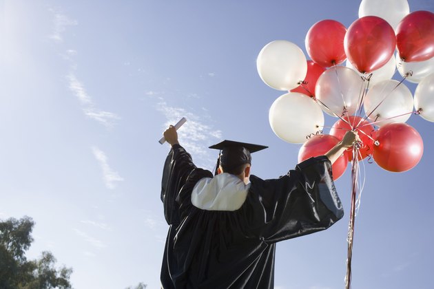 Graduate with balloons