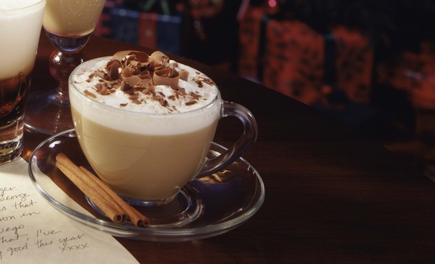 Cappuccino with chocolate and cinnamon sticks