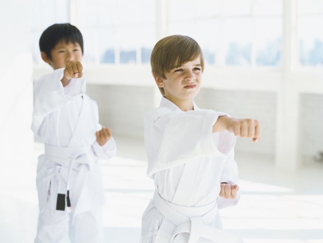 two boys practicing judo