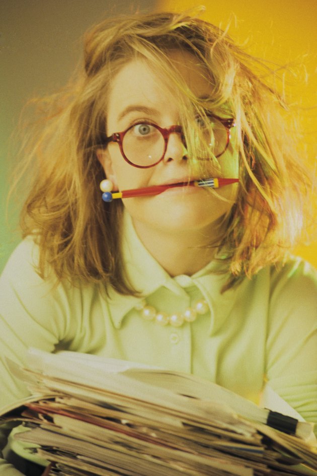 Frazzled businesswoman with paperwork