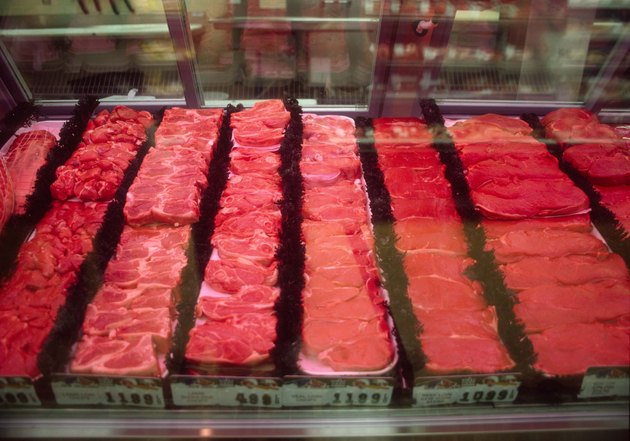 Assorted cuts of meat in butcher case