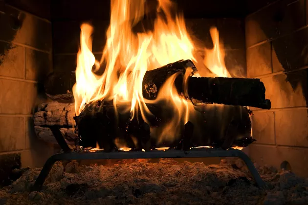 Logs blazing in a fireplace