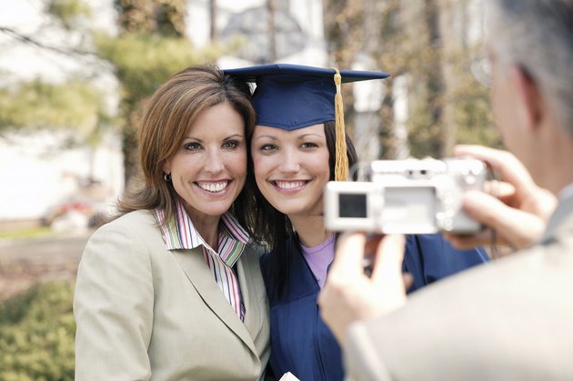 Graduate posing for picture with mom