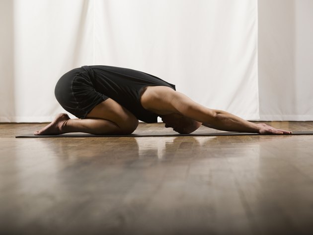 Hispanic man practicing yoga