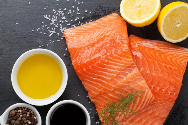 Salmon and spices on stone table. Top view
