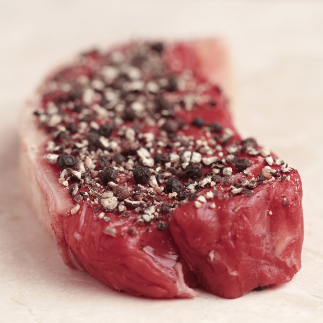 Cut of red meat sprinkled with spices