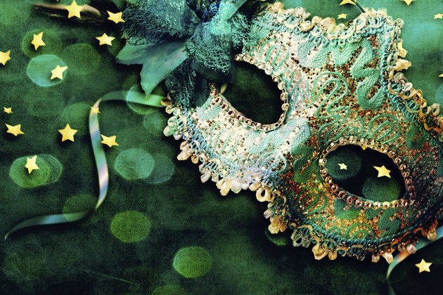 Female carnival mask with shiny background.