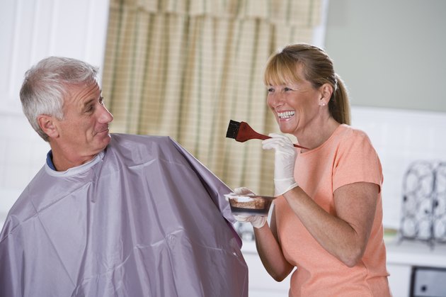 Woman with hair dye for man