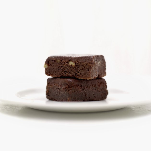 Close-up of a pile of two chocolate brownies on a plate