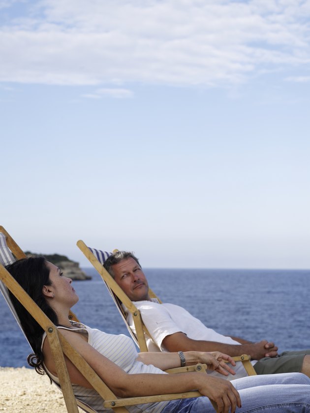 Man and woman look out to sea