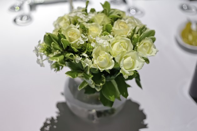 White roses in a glass vase.