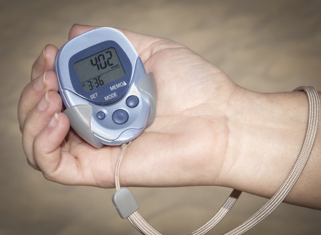 Woman Holding Pedometer