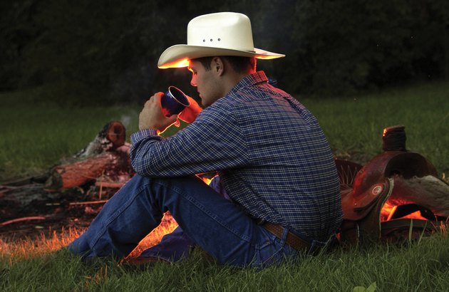 Cowboy near campfire