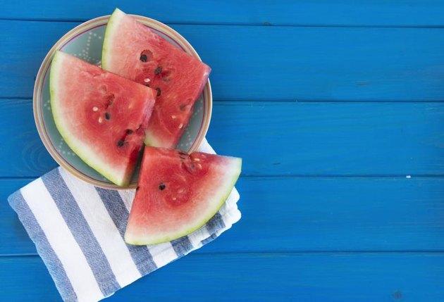 watermelon on a blue desk
