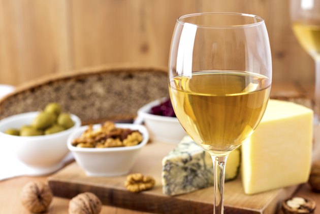White Wine and cheese arrangement on the table