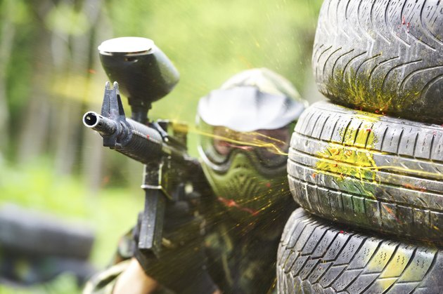 paintball player under gunfire