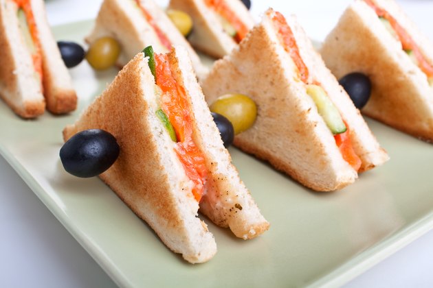 club sandwiches with salmon and cucumbers