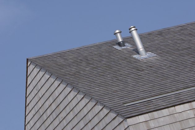 Ventilation pipes on roof of building