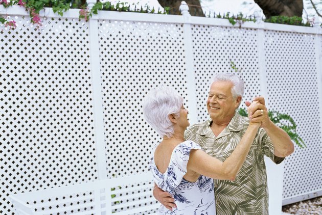 Side view of a senior couple dancing