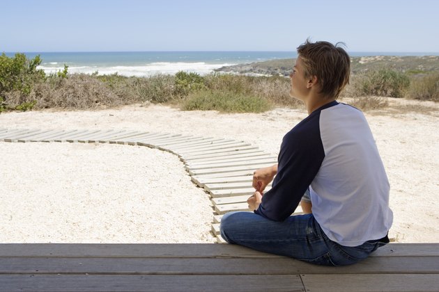 Man sitting near beach