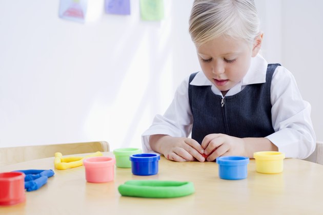 Girl playing with clay