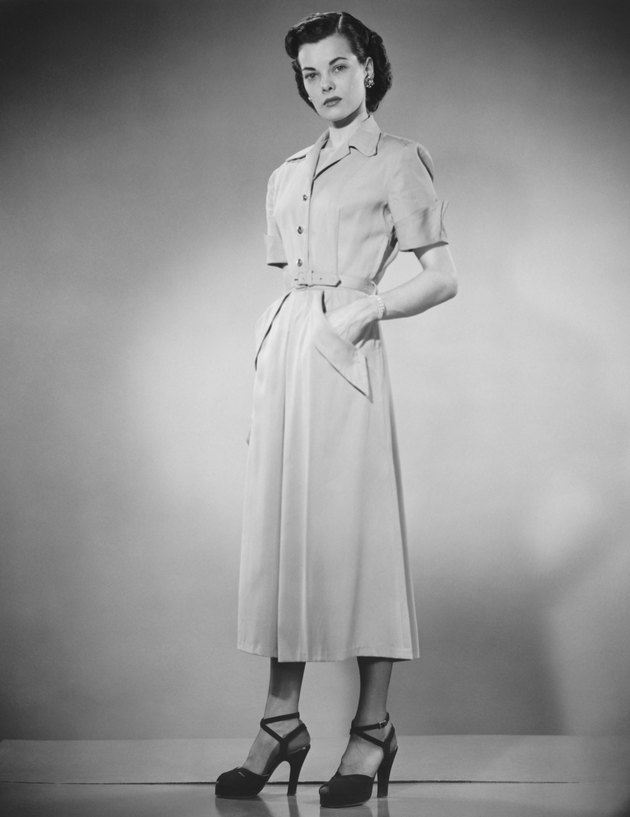 Woman posing in studio (B&W), portrait