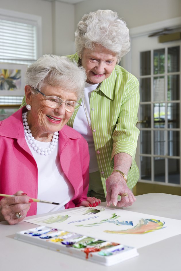 Elderly women painting