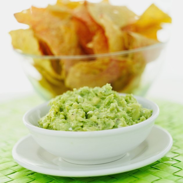 close-up of a bowl of nachos with dip