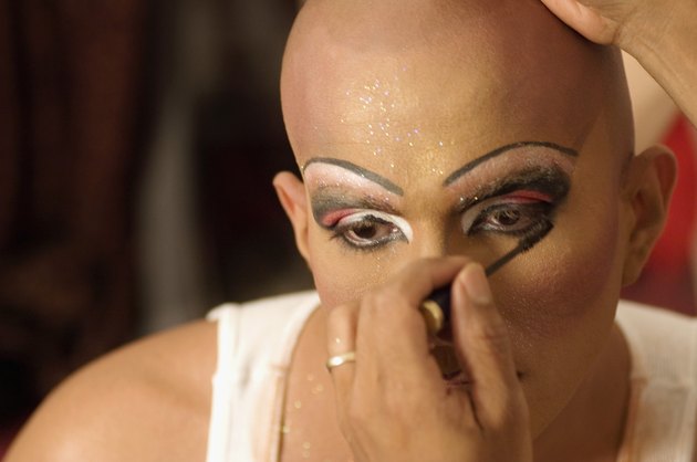 Drag queen applying mascara
