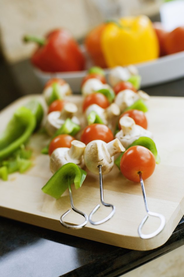 Shish kabobs on cutting board