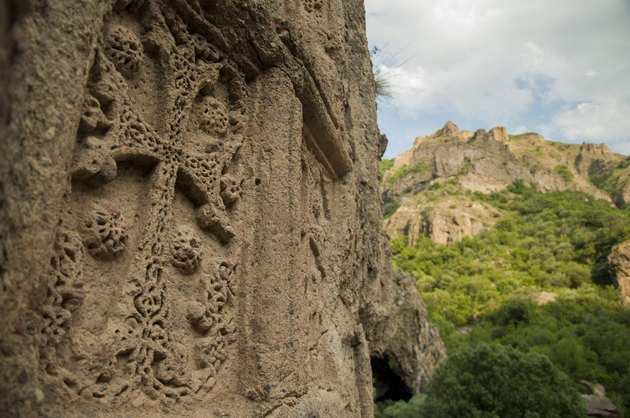 Stone carved medieval cross at Geghard monastery