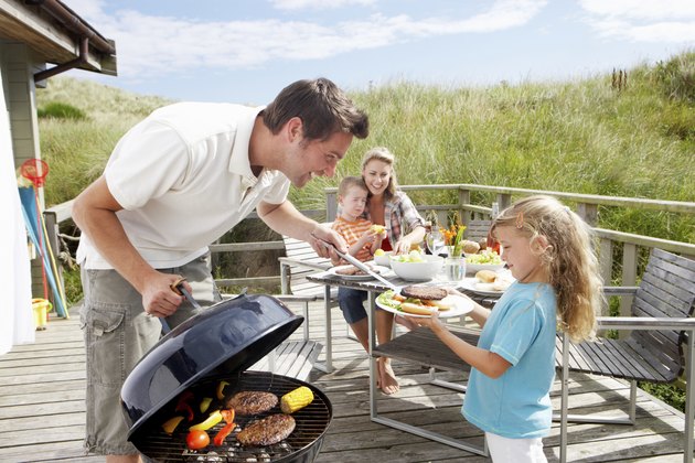 Family on vacation having barbecue