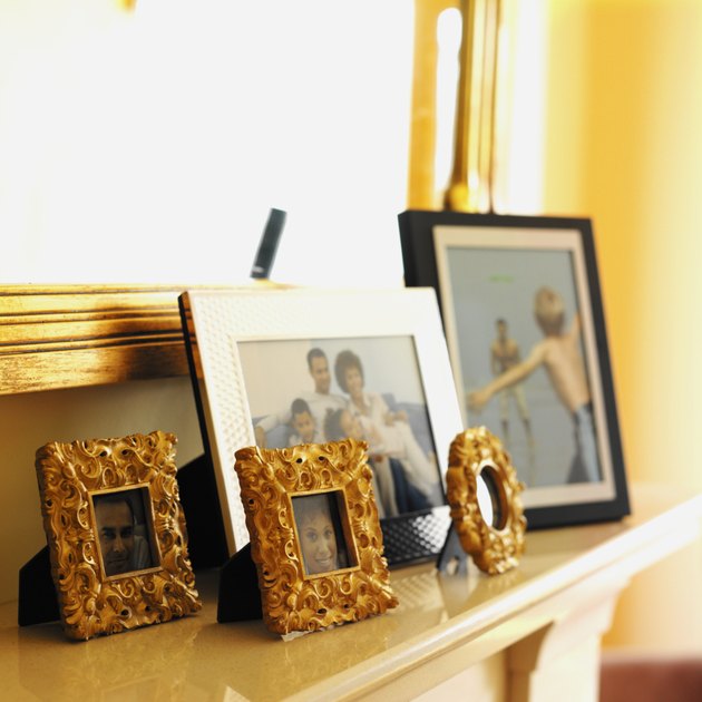picture frames on a mantelpiece