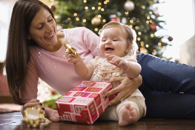 Mother and baby girl with Christmas gift