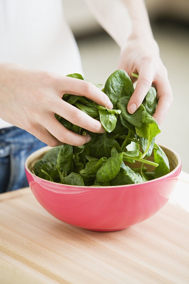Person preparing spinach