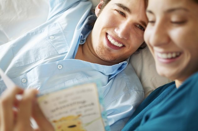 Couple reading greeting card