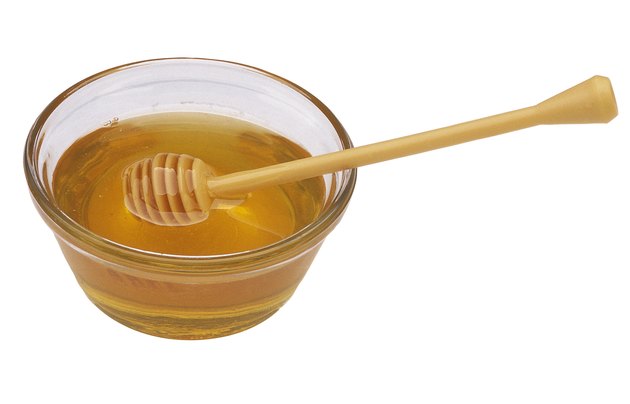 Honey with dipper
