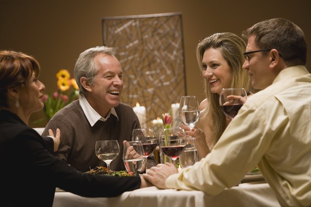 Friends chatting at dinner party