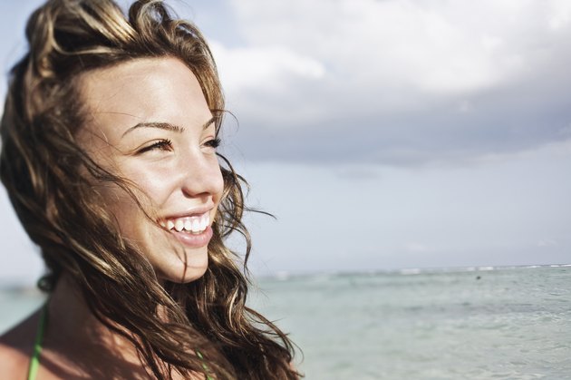 Smiling teenage girl at beach